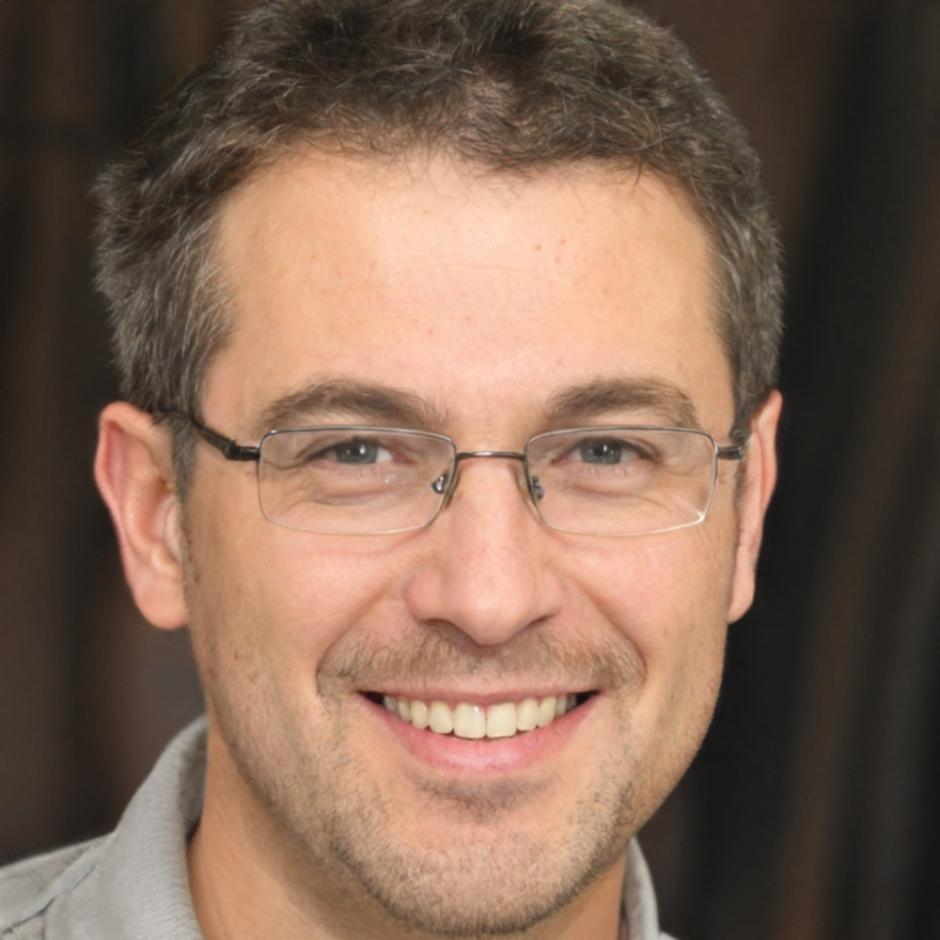 Professional headshot of male financial instructor
